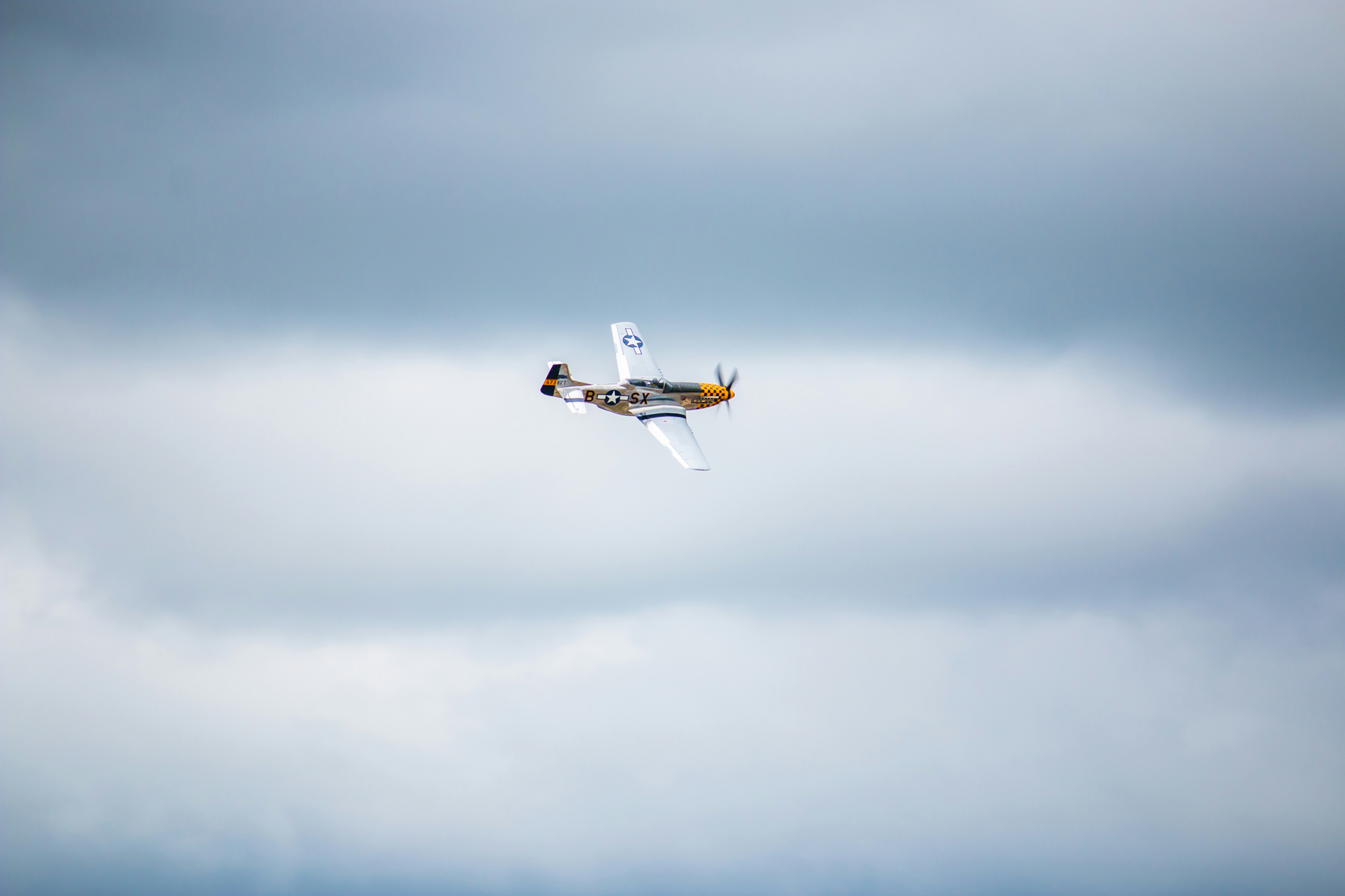 a small airplane flying in the sky