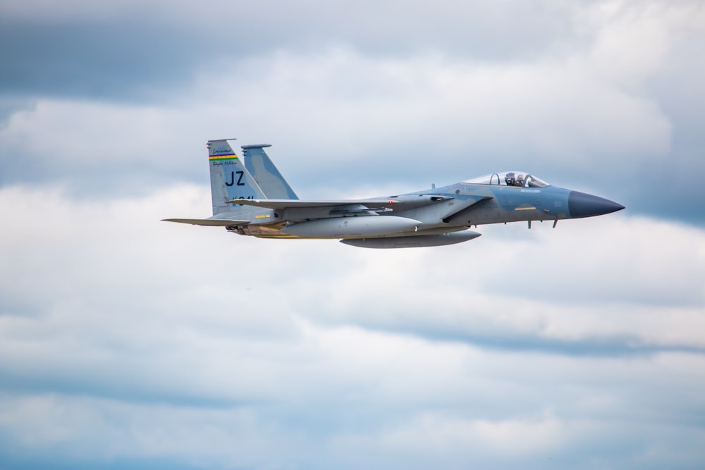 a couple of fighter jets flying in the sky