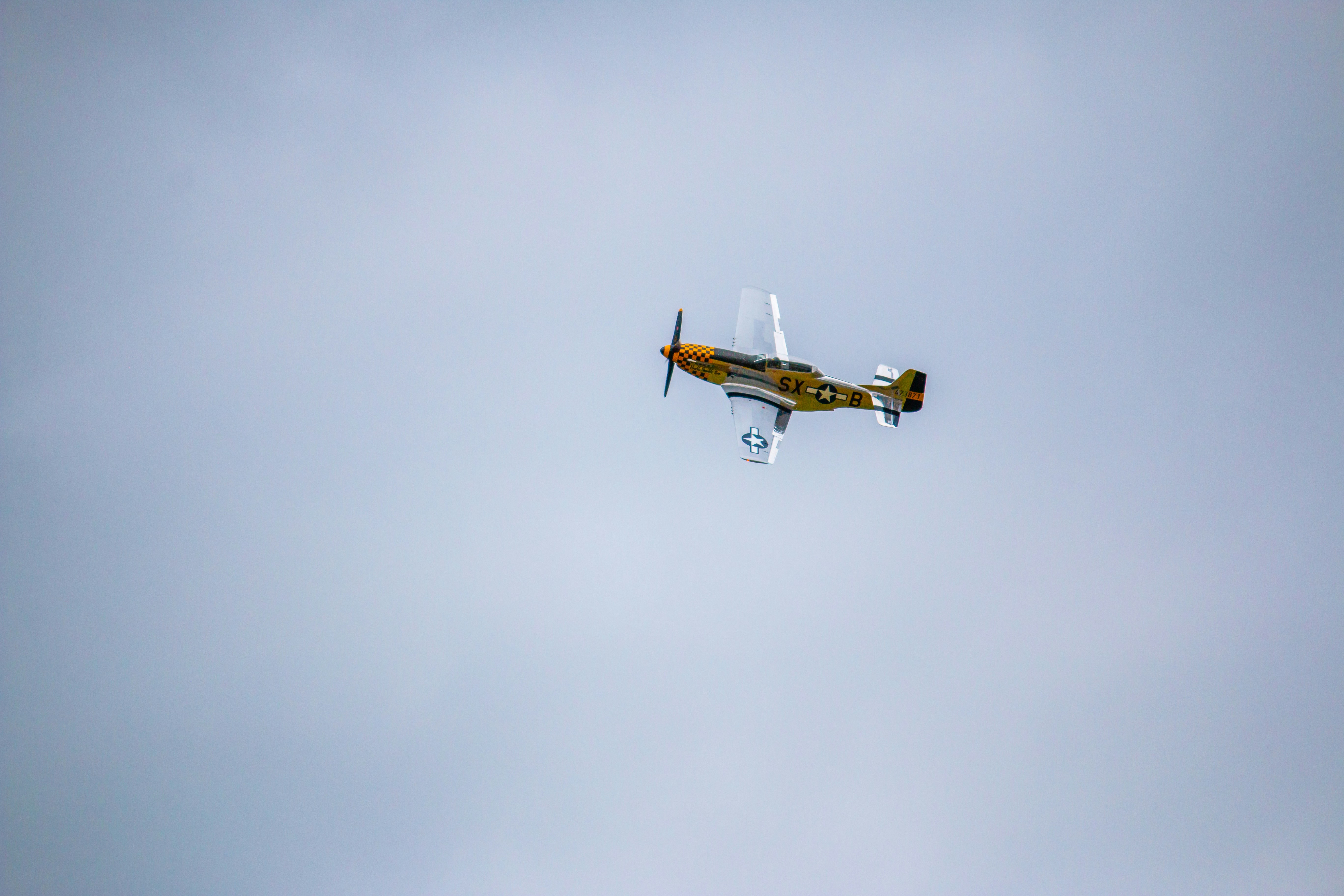 a small airplane flying in the sky