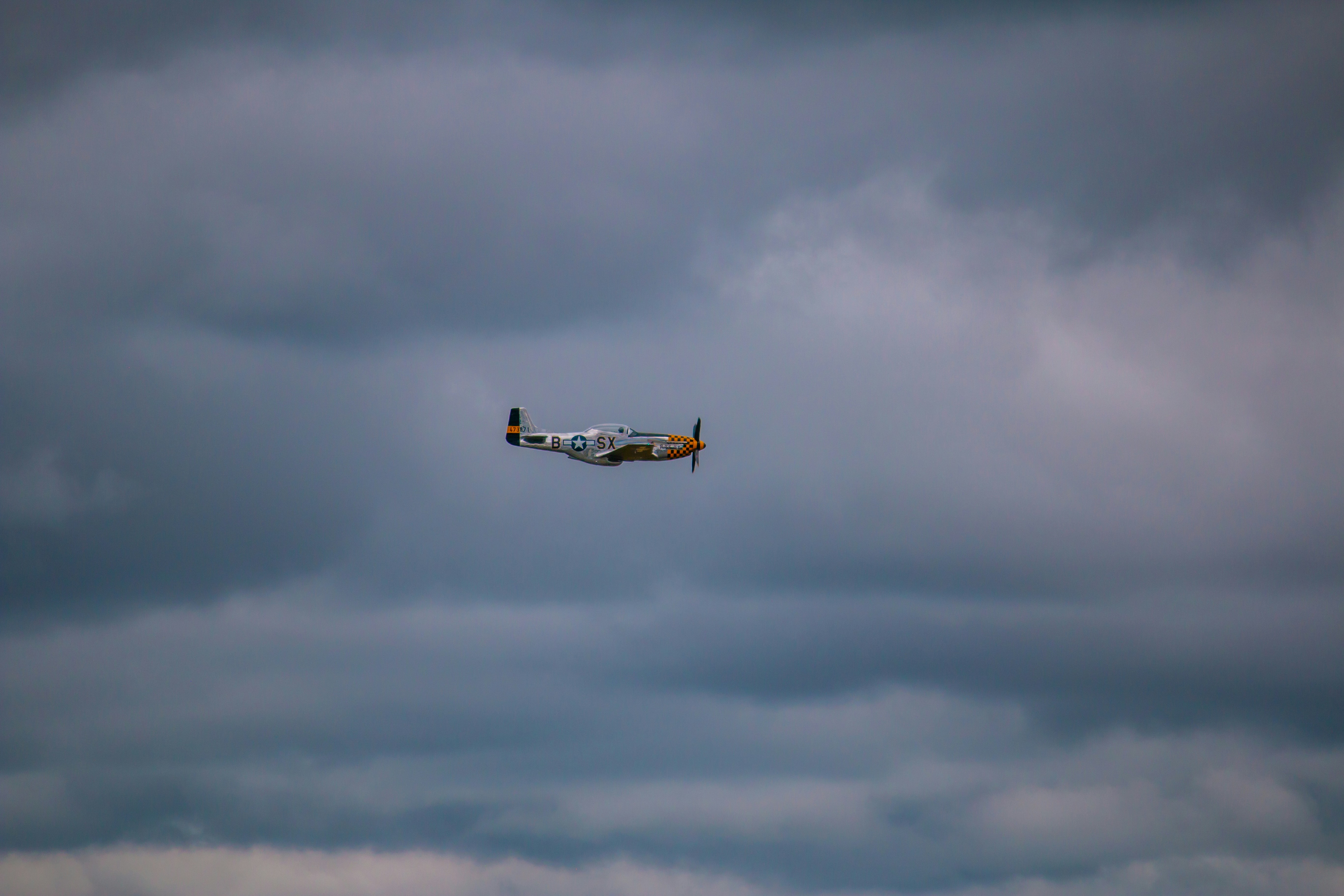 a small airplane flying in the sky