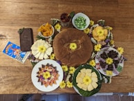 A close-up of fresh Swiss chocolate and cheese delicacies on a rustic wooden table.