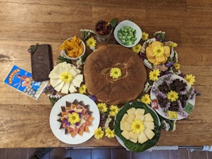 A vibrant spread of homemade snacks arranged beautifully on a rustic wooden table.
