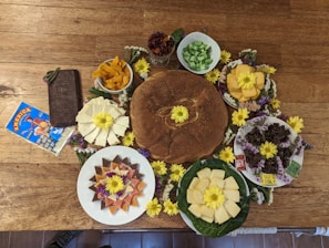 An assortment of acm foods products arranged aesthetically on a wooden table.