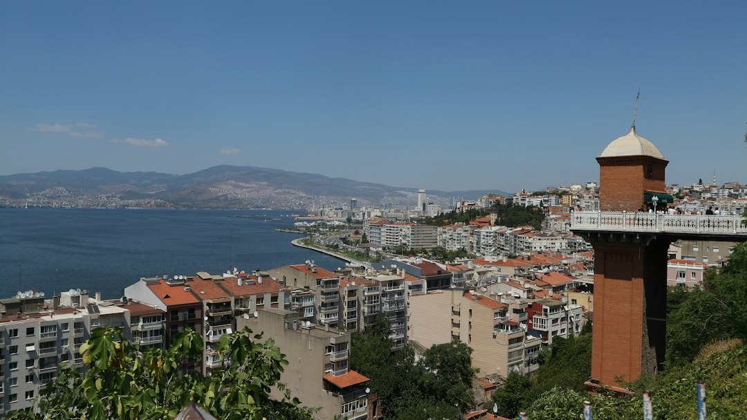a city with a body of water in the background