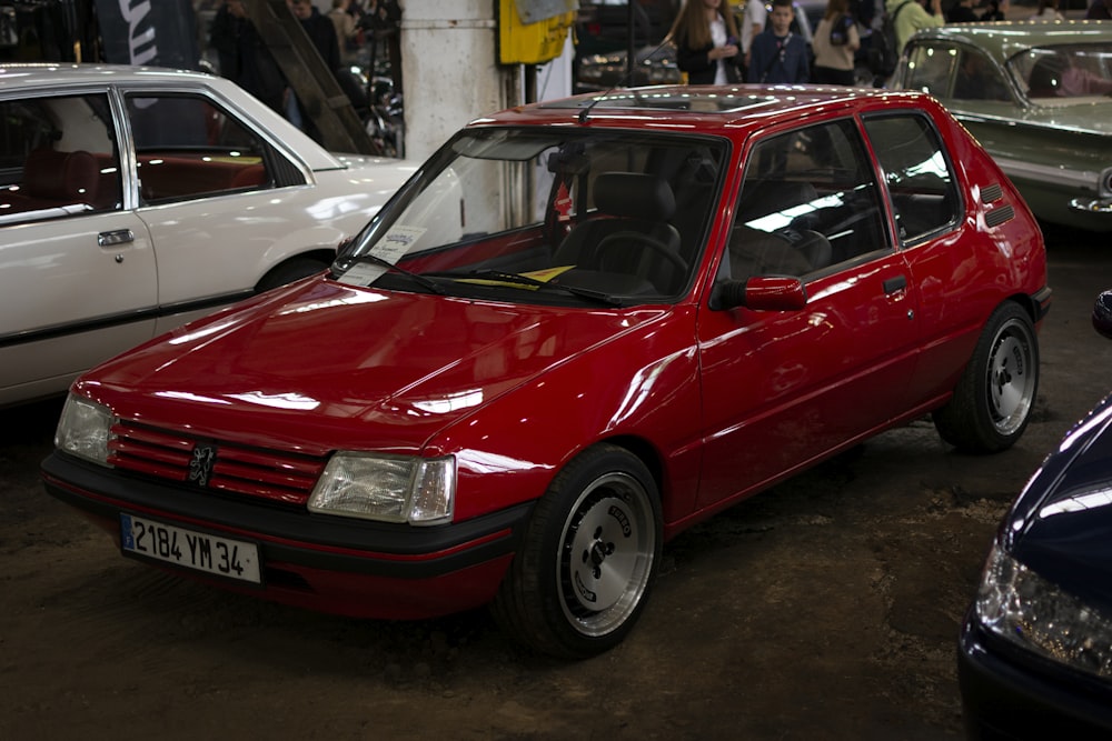 a red car parked in a showroom