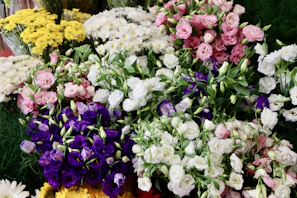 Bright and cheerful mixed flower arrangement featuring lilac, magenta, and white blooms
