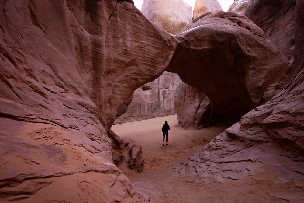 a person standing in a cave