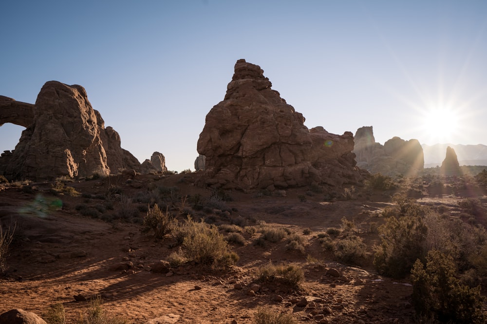 a desert landscape with tall rocks