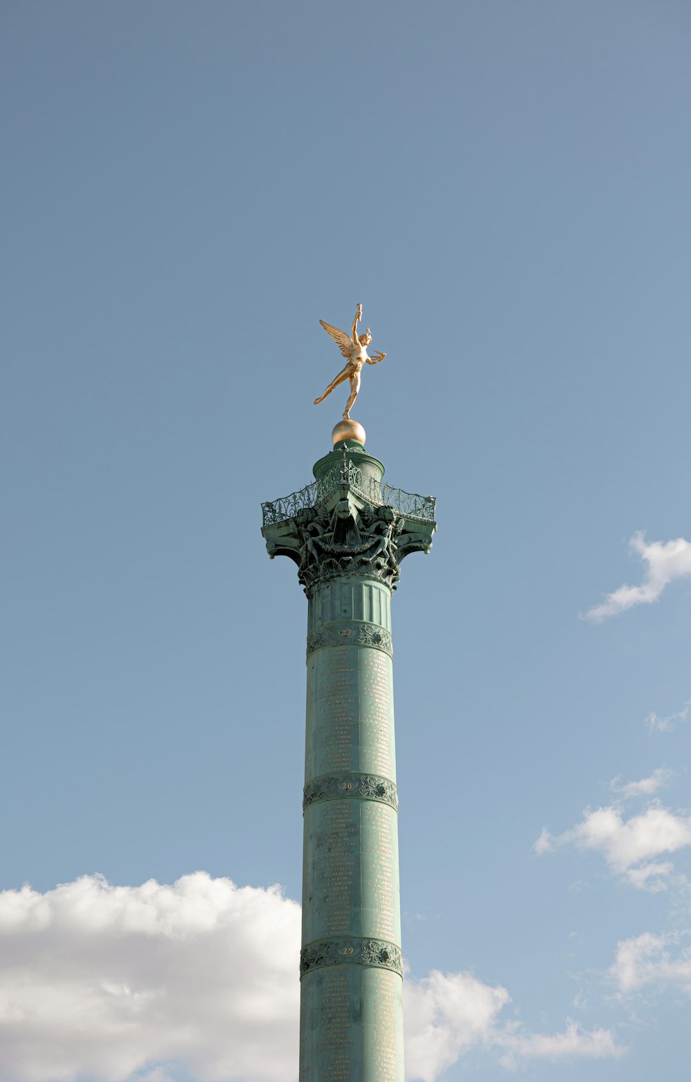 a statue on top of a tower