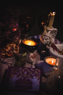 a candle and a statue