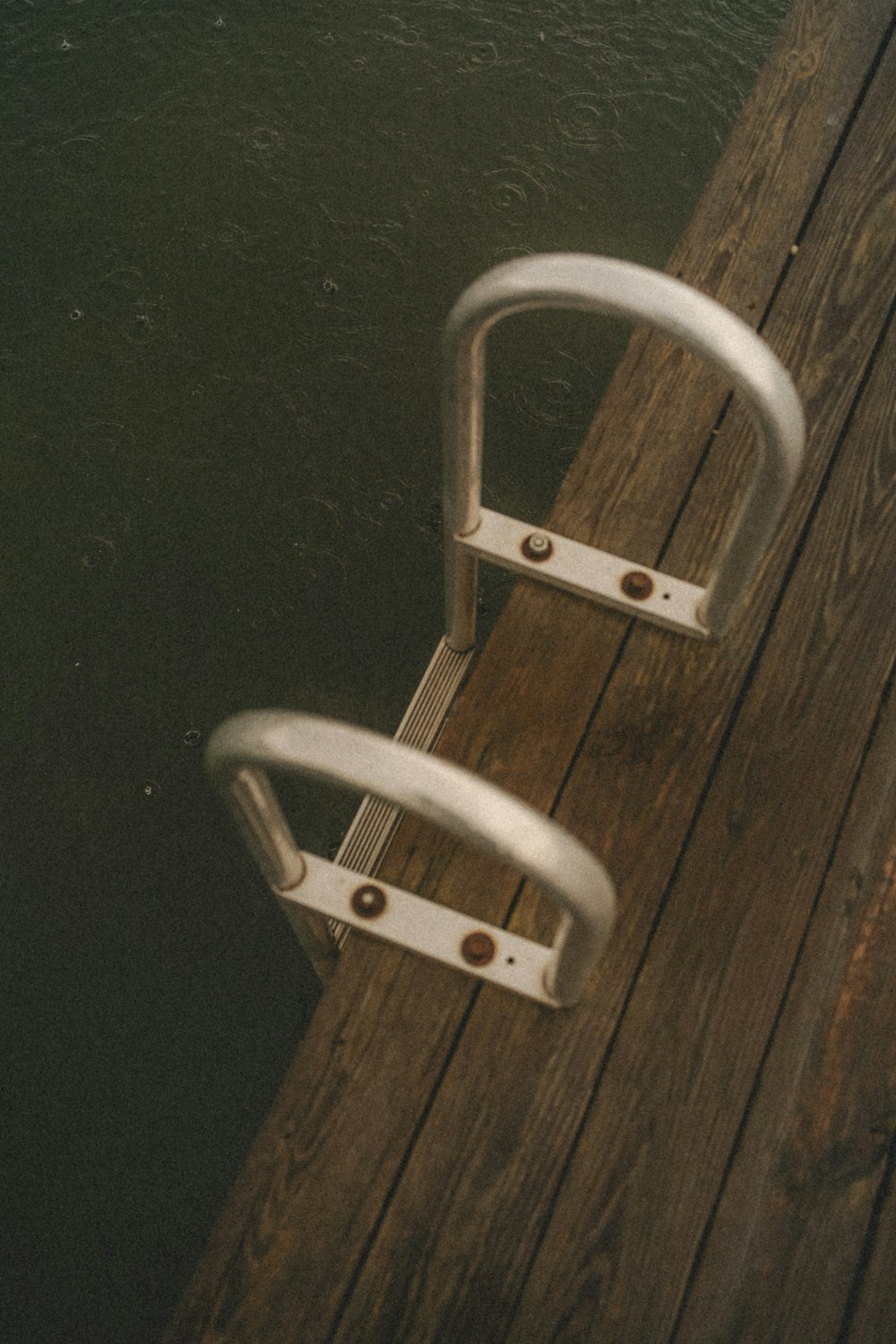 a metal key on a wooden surface