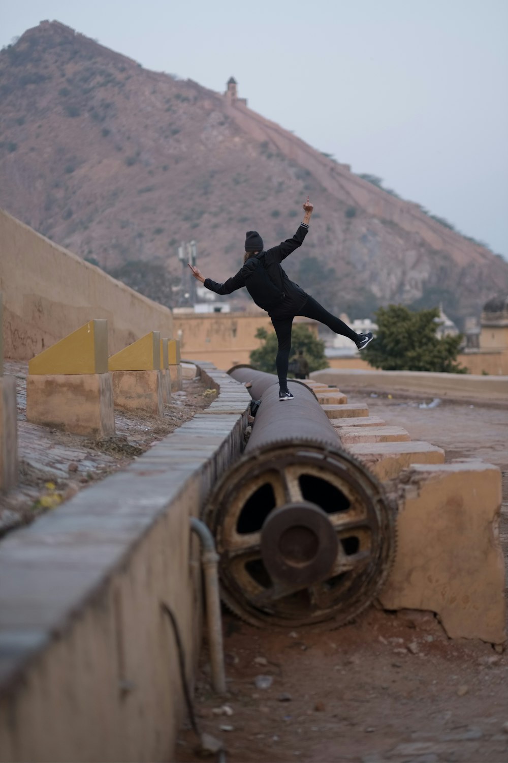 a statue of a man on a cannon