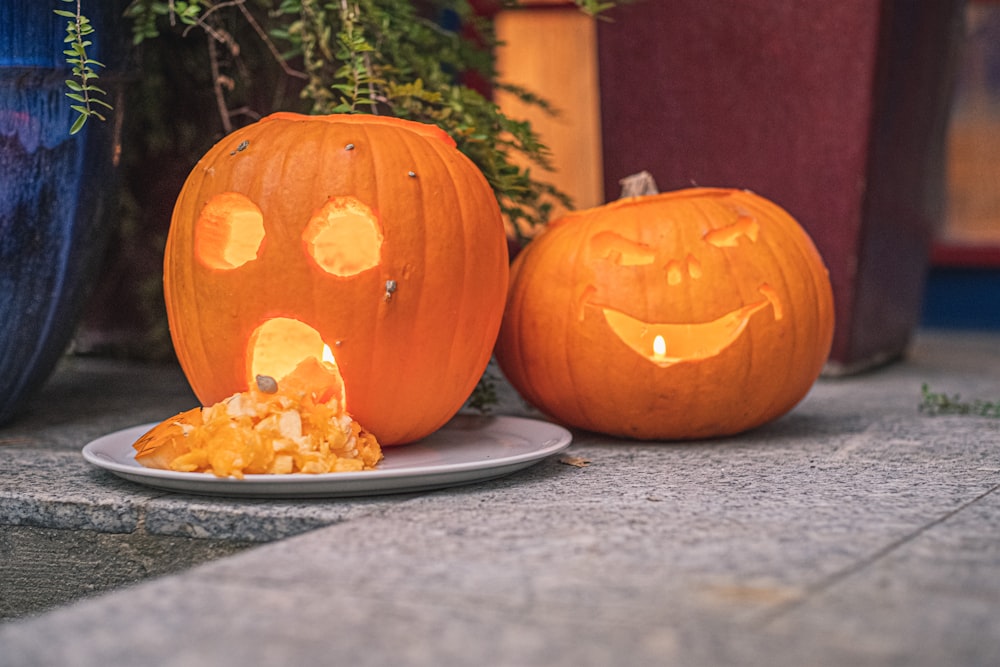 a couple of carved pumpkins