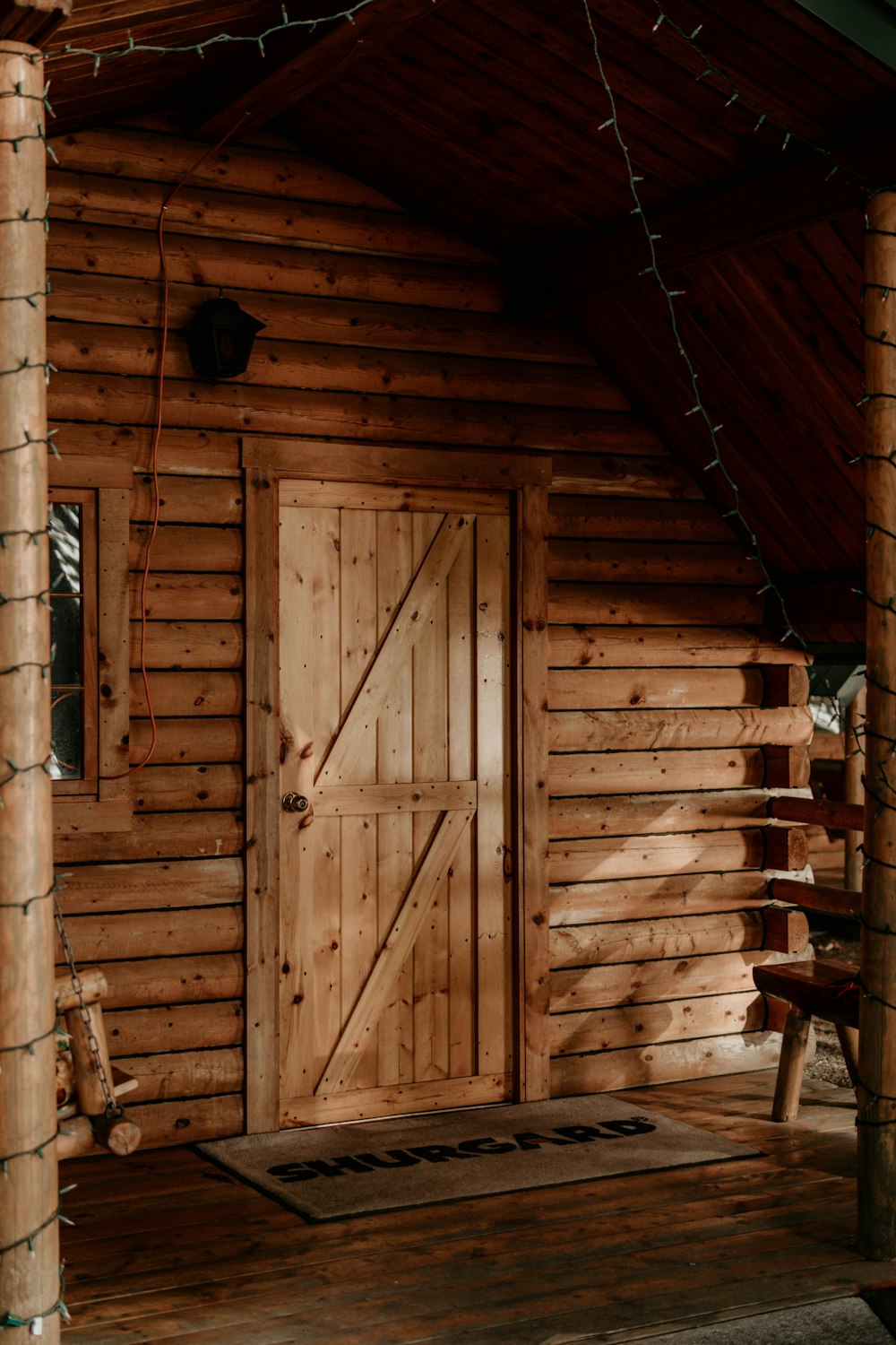 a wooden cabin with a wooden door