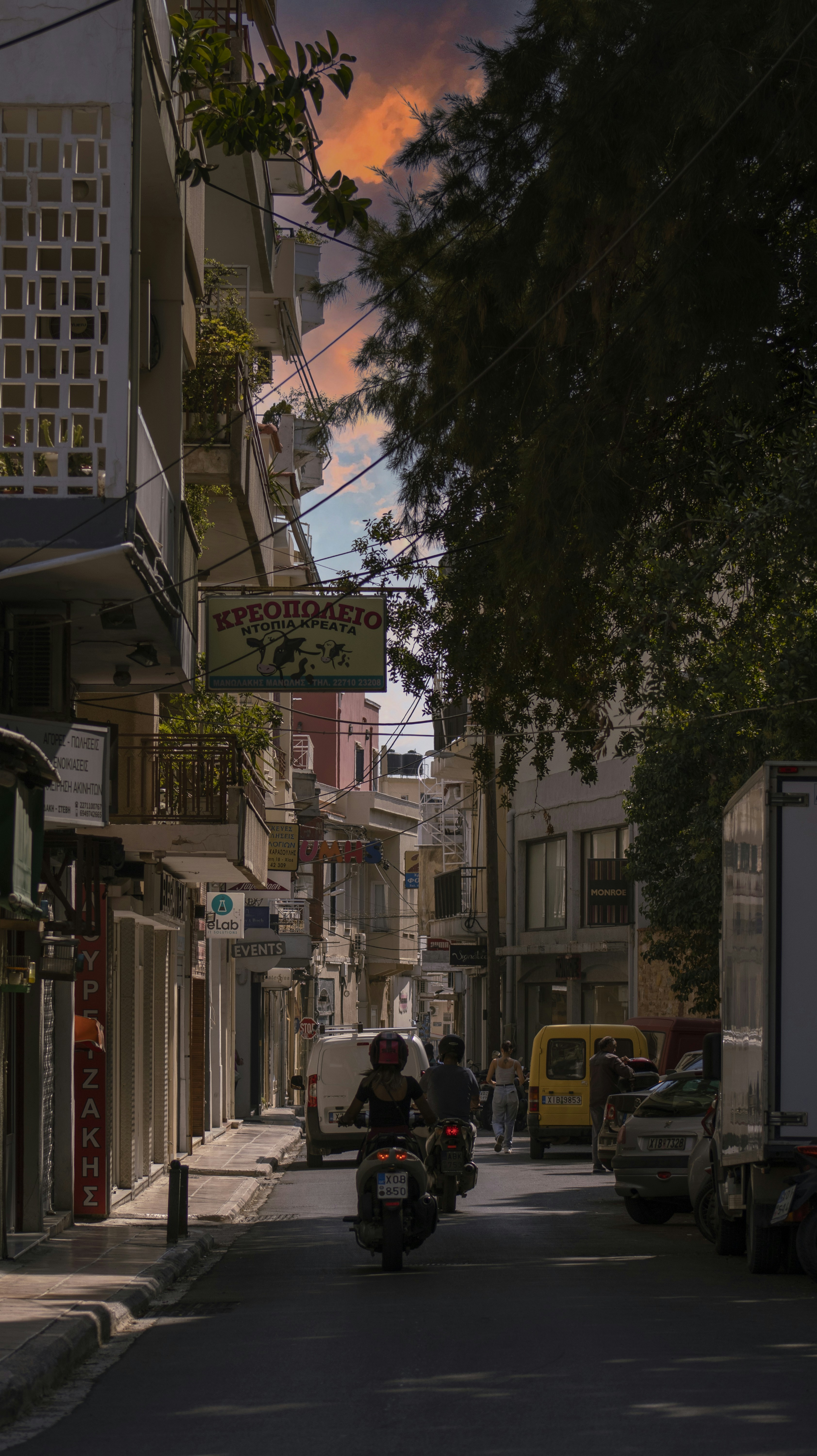 a person riding a motorcycle down a street