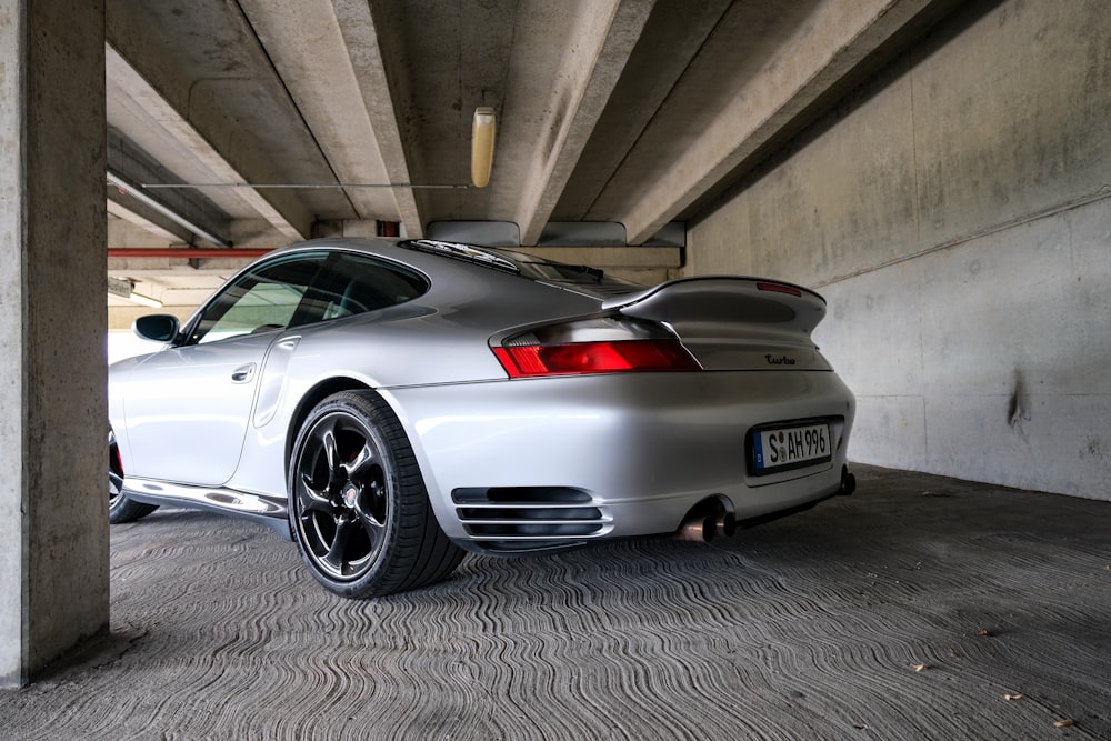 a silver car parked in a garage