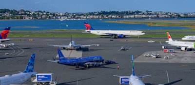 a group of airplanes at an airport