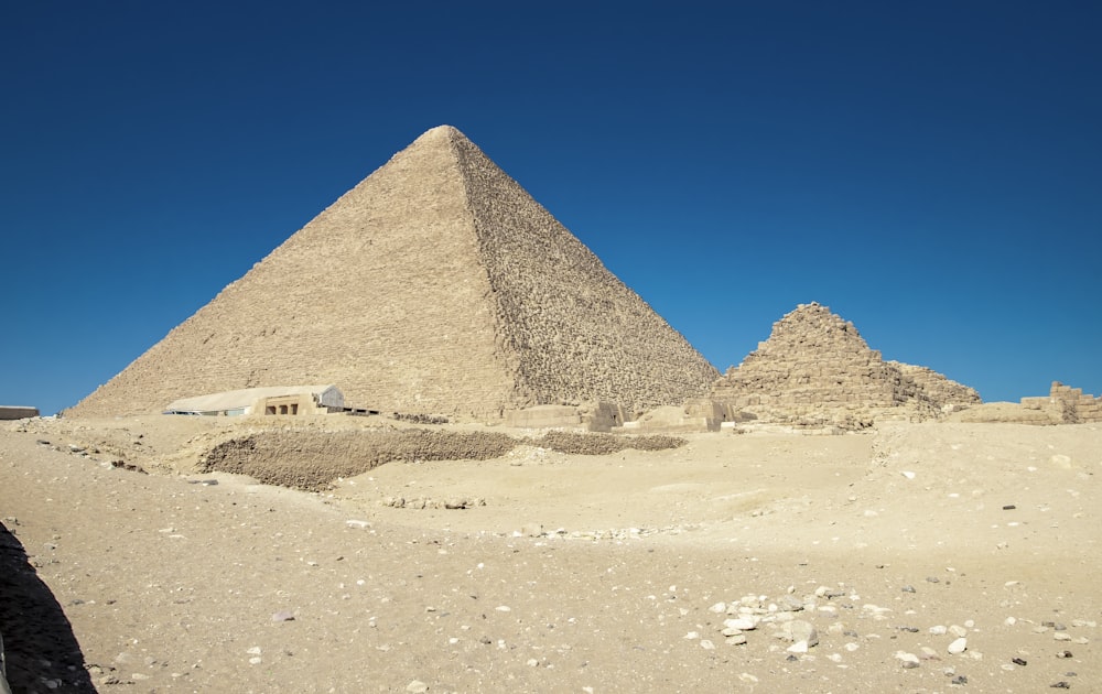 a group of pyramids in a desert