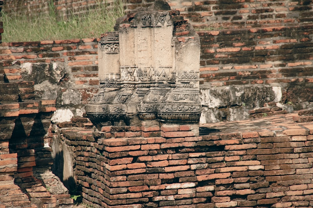 a brick wall with a stone tower