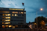 An inspiring office view showing the Innoscale Solutions logo illuminated against a city skyline at dusk.