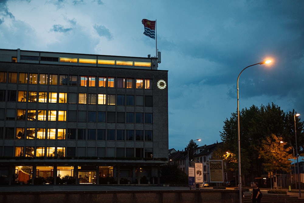 a large building with a flag on top