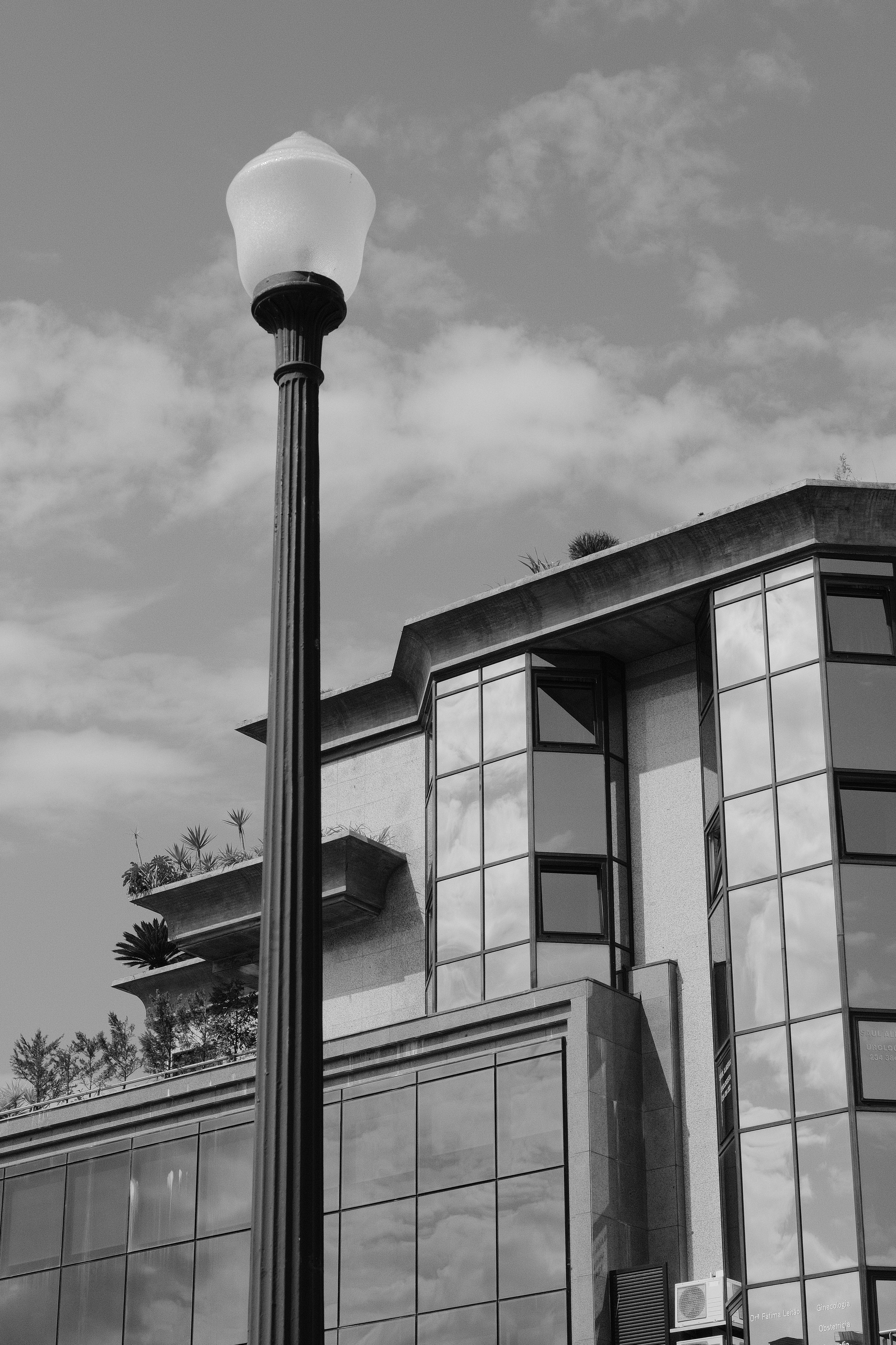 a lamp post in front of a building