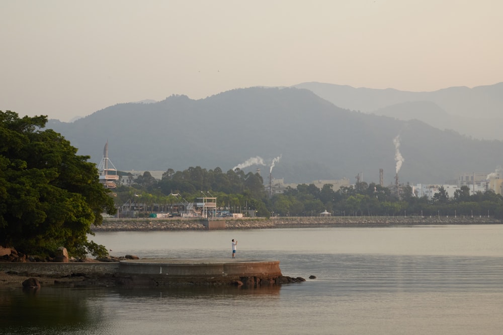 a body of water with a city in the background