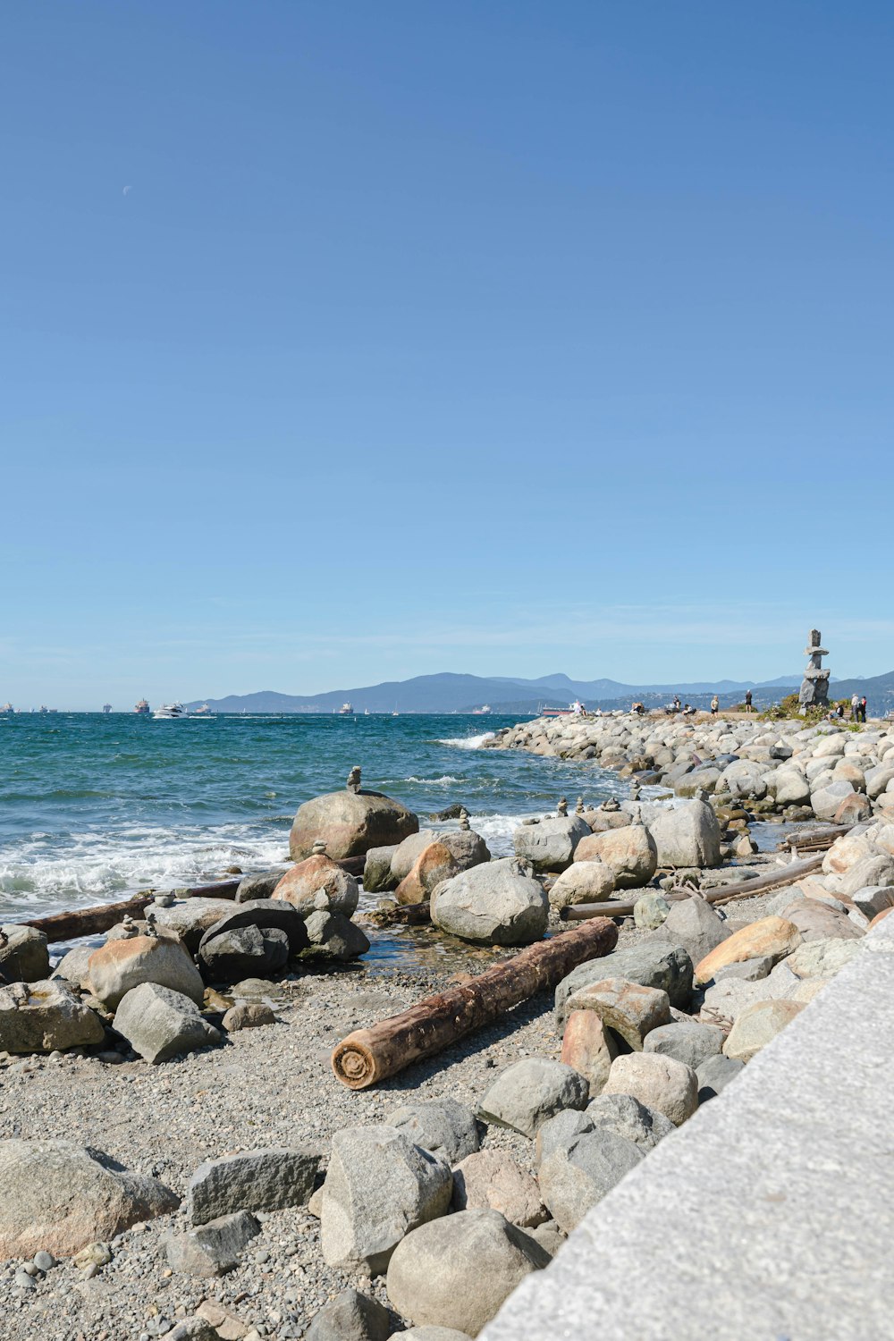 a rocky beach with a lighthouse