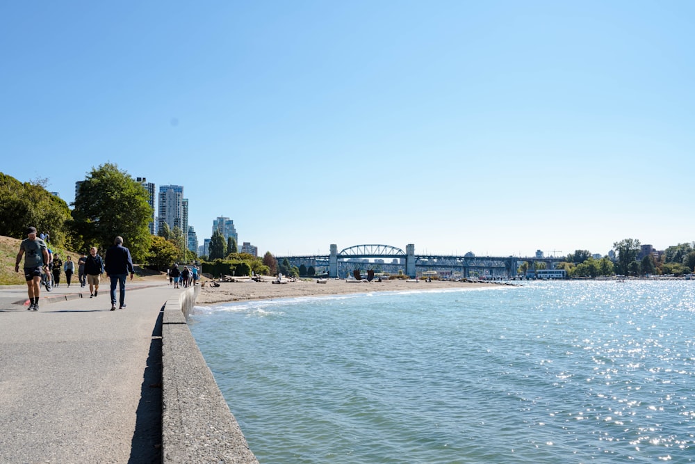 people walking along a beach