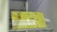 A sign is displayed with yellow and white colors featuring the text 'ELETRONIC TEMP. CONTROL' along with 'Soft Touch Digital Display.' The background has a soft yellow hue with circular patterns resembling bubbles or holes. The brand 'Homa' is visible along with a 20th-anniversary symbol.