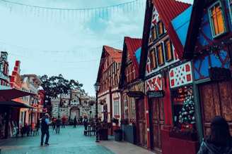 a street with buildings and people