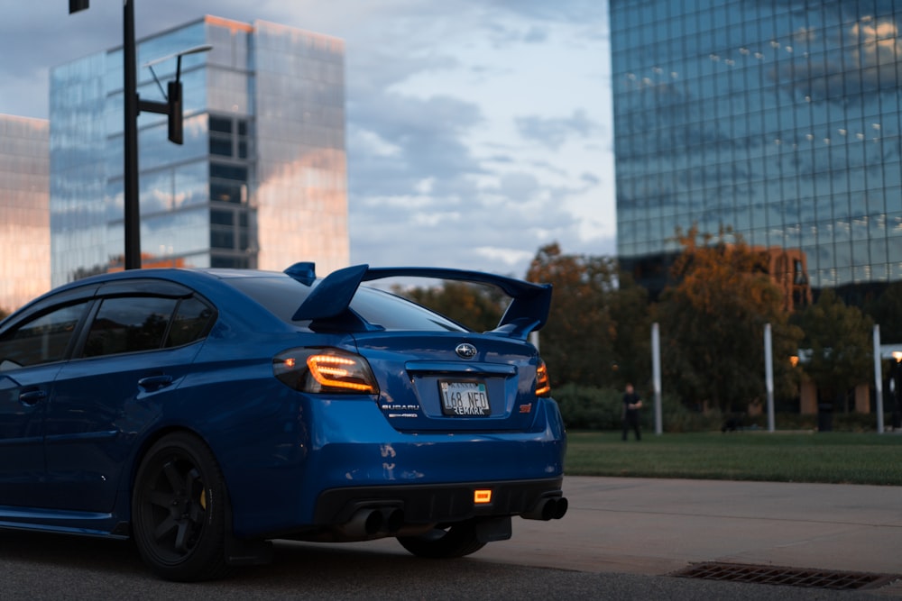 a blue car on the street