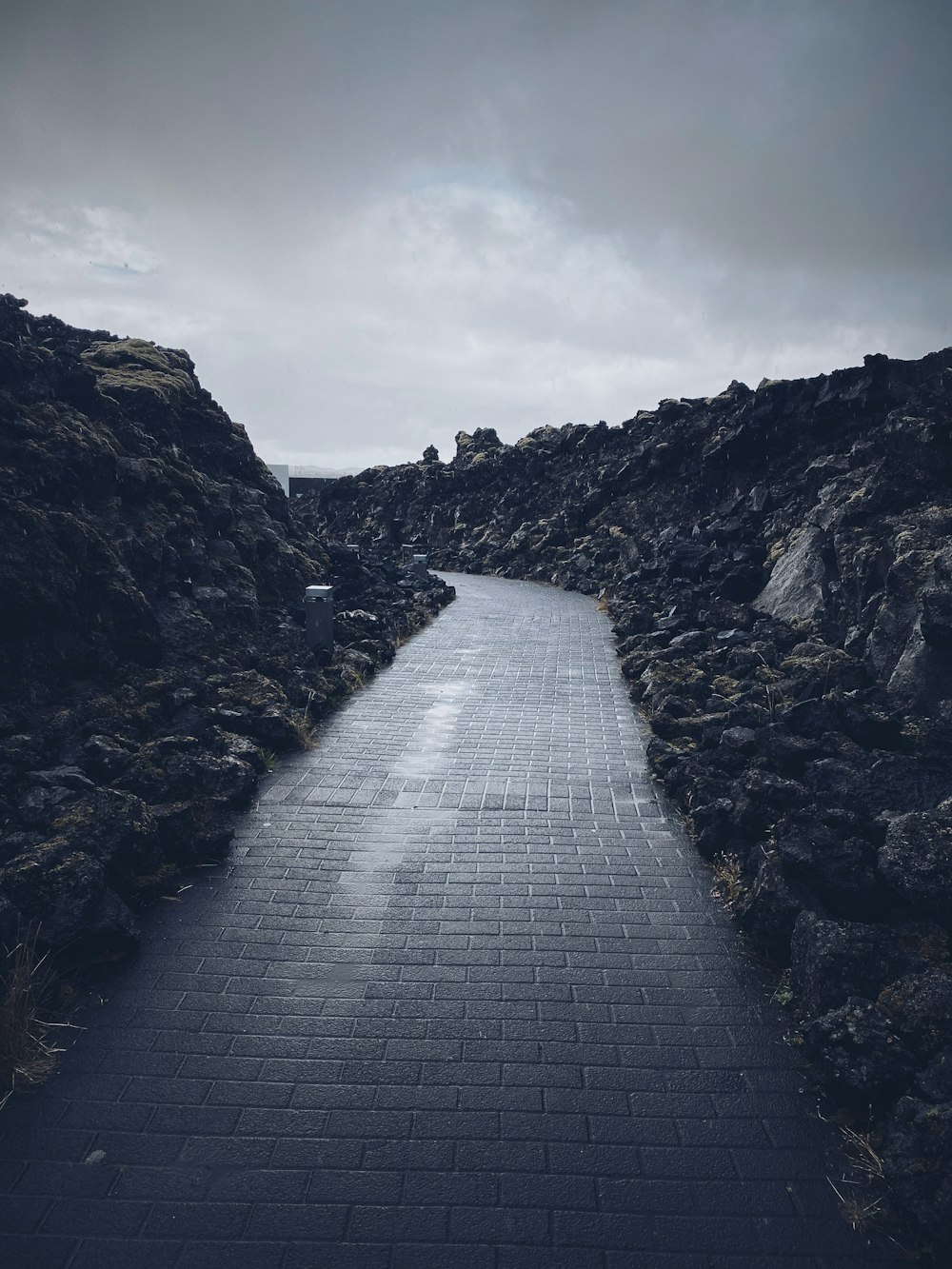 a stone pathway between rocky cliffs