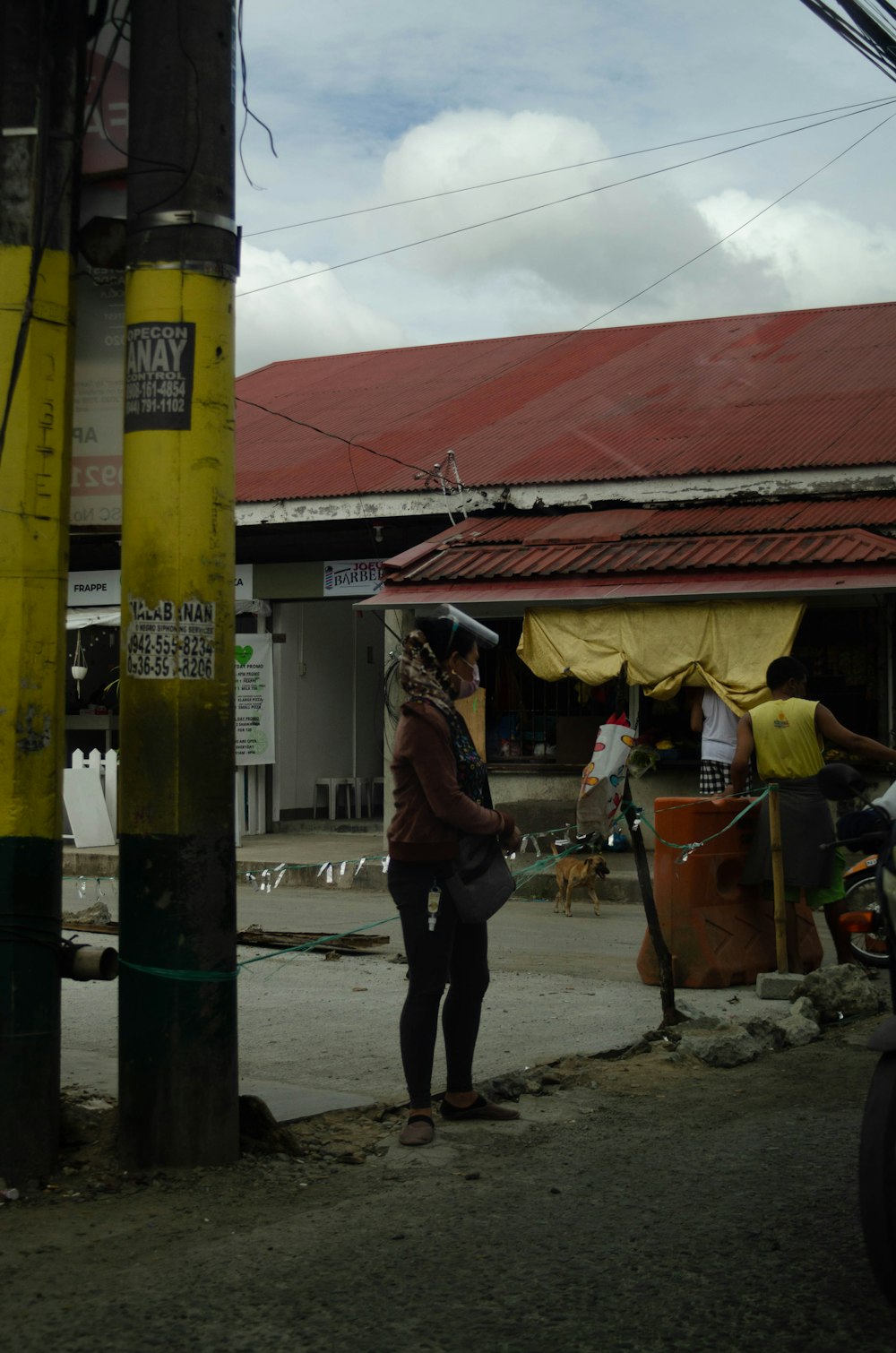 a man standing outside a shop