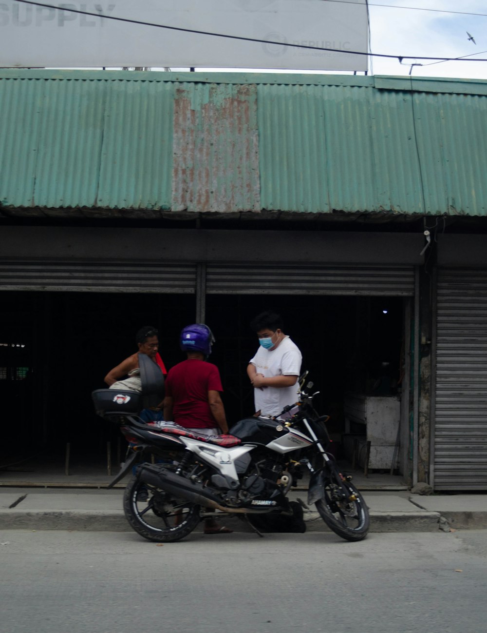 a group of men on a motorcycle