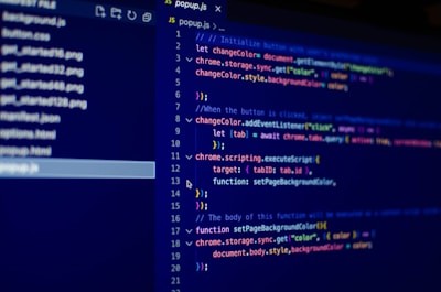 The image displays a computer screen with a code editor open. The code editor contains a JavaScript file named popup.js. Lines of code are written with various syntax coloring, typical for JavaScript. On the left side of the screen, there is a file explorer showing a list of files and directories.