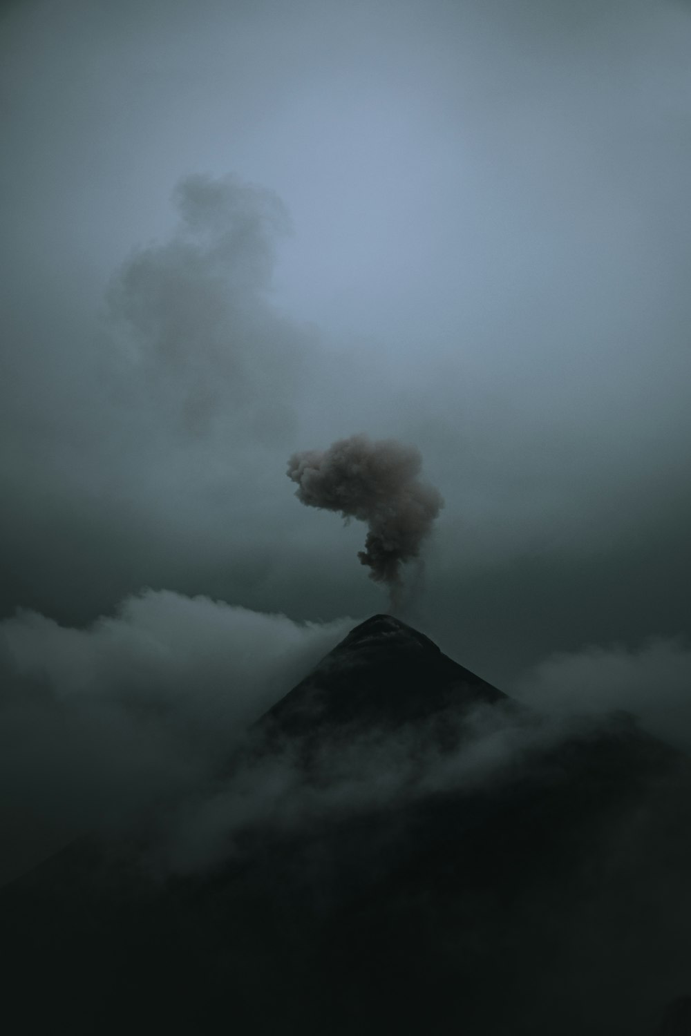 a mountain with smoke coming out of it