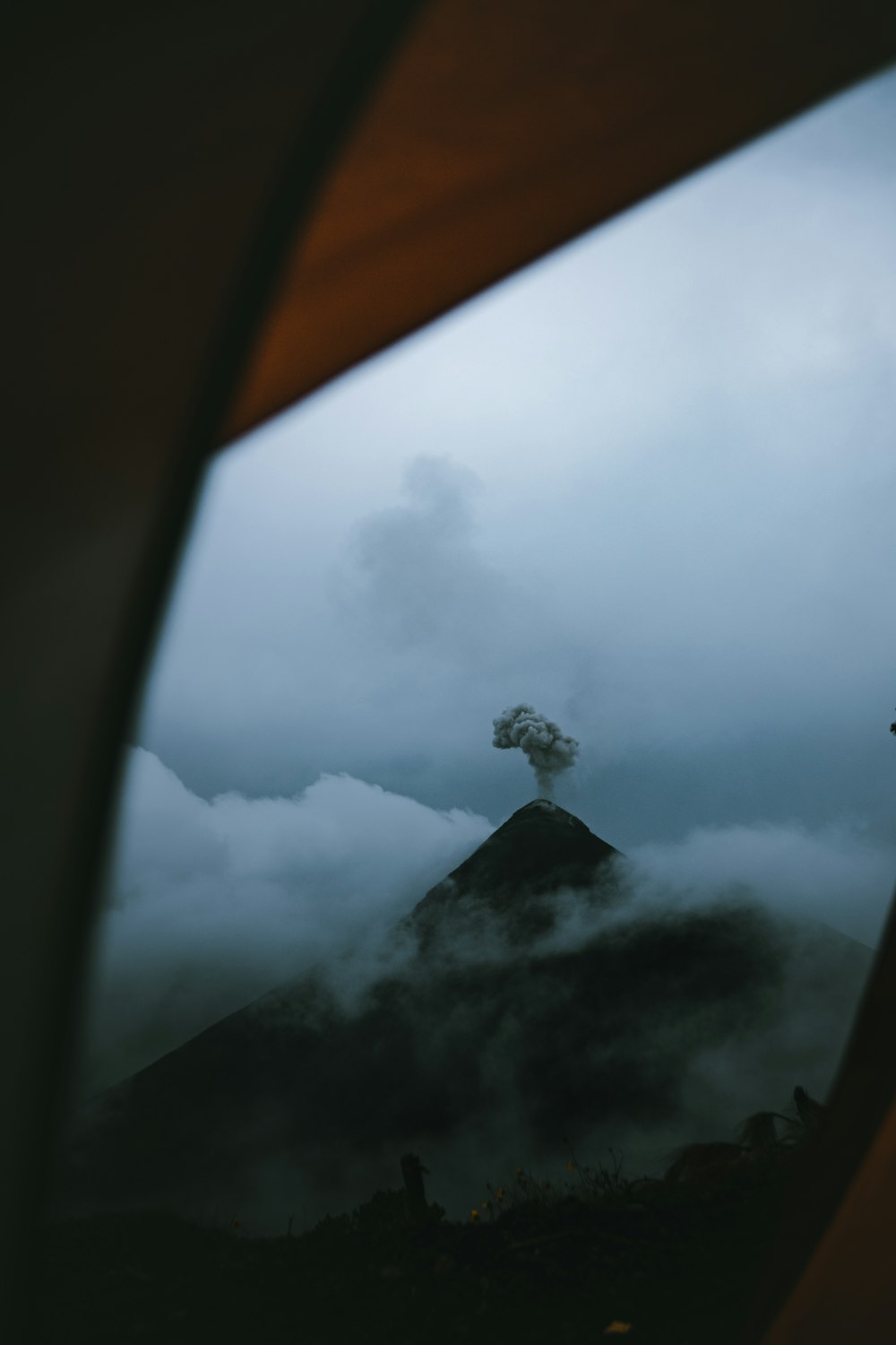 a view of a mountain from a window