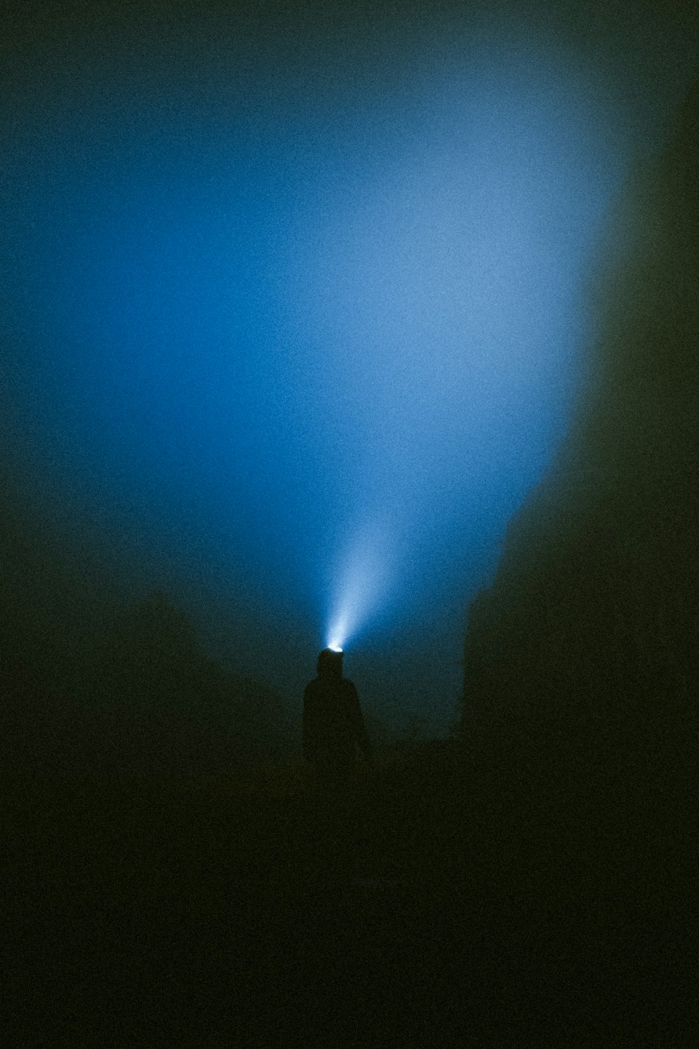 a person standing in a dark area