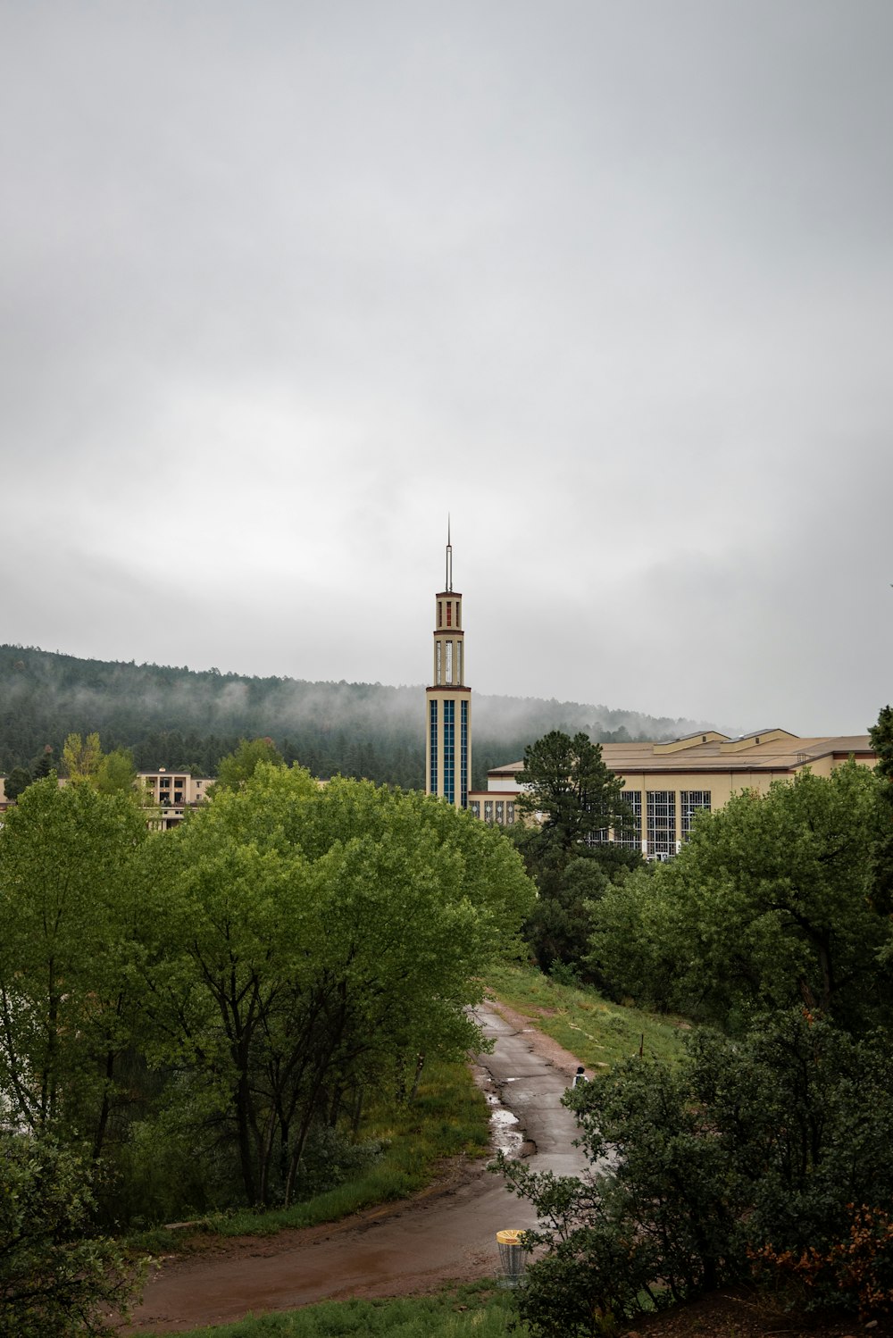 a building with a tower in the distance