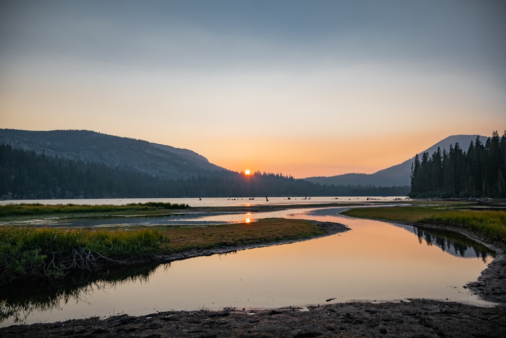 a river with a sunset