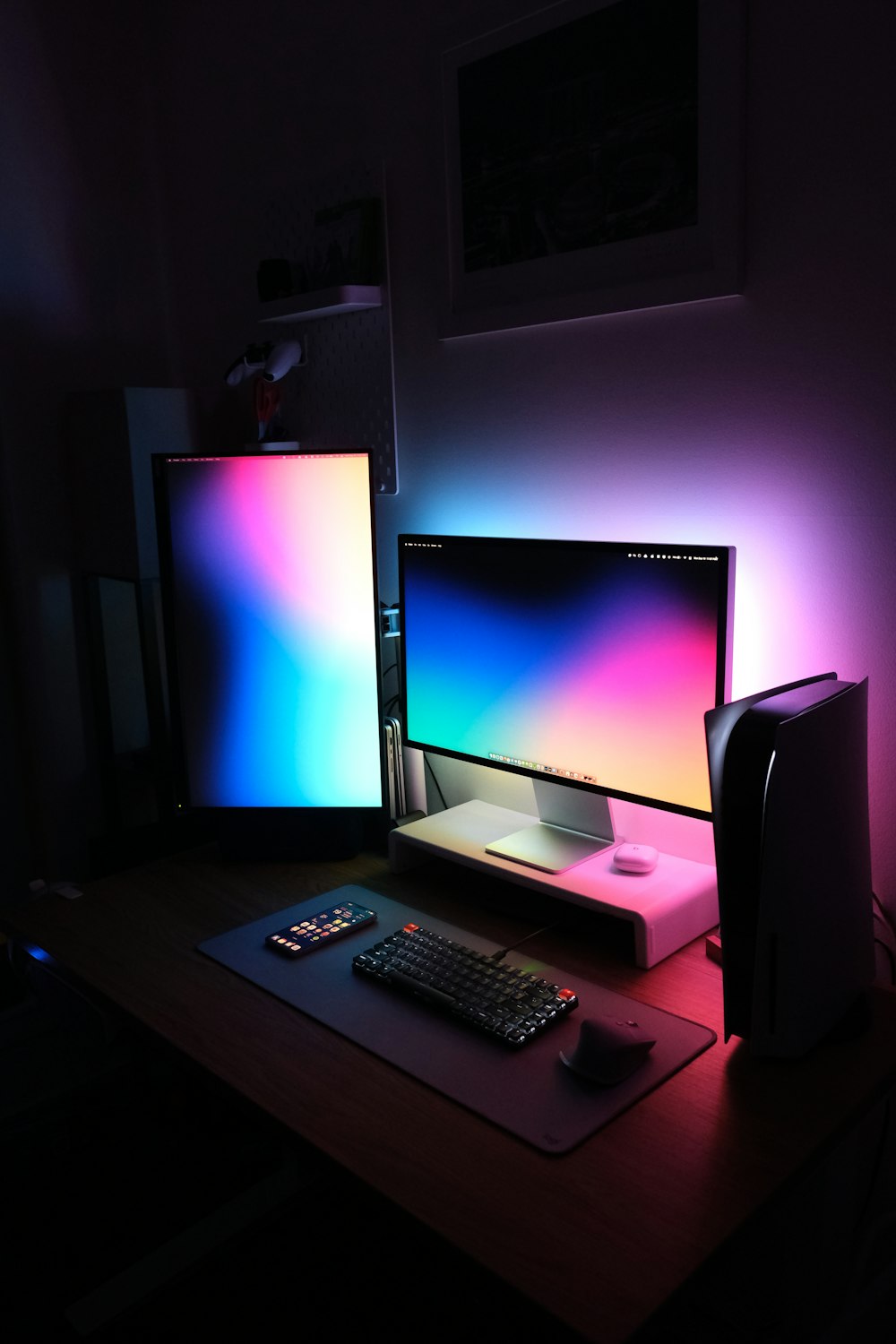 a desk with a computer and a monitor on it
