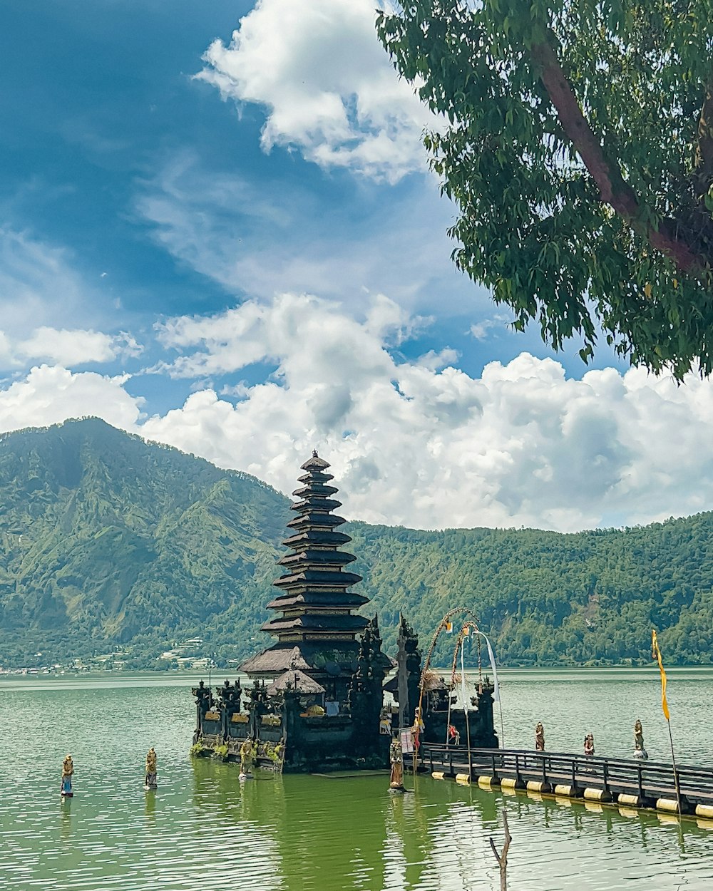 a dock with a tower on it by a body of water