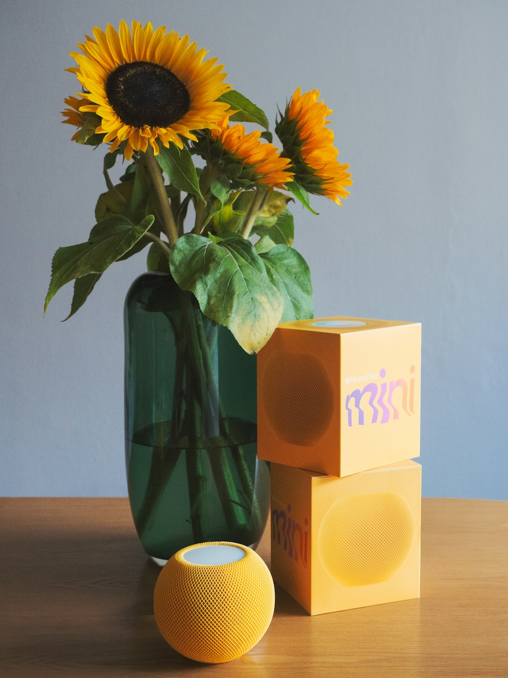 a vase with sunflowers