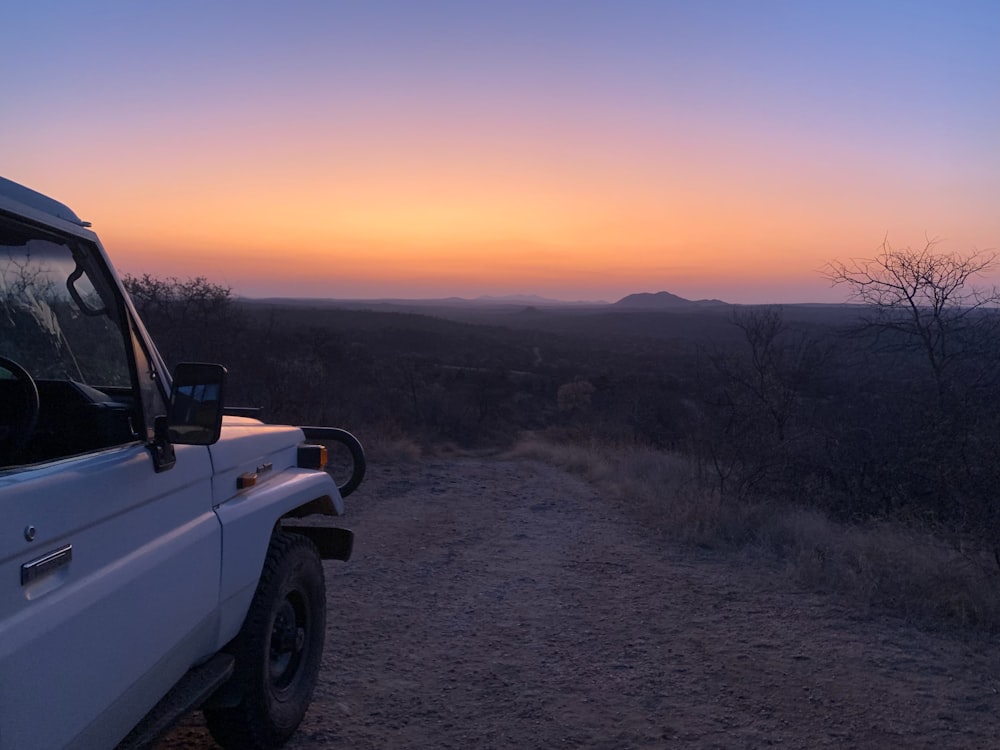 a car parked on a dirt road