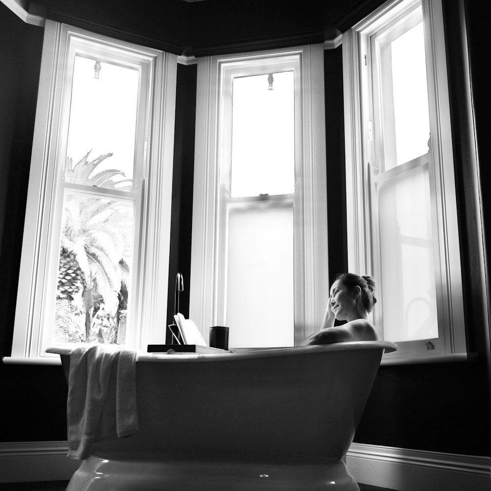 a person sitting in a bathtub