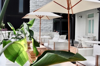 a patio with tables and chairs