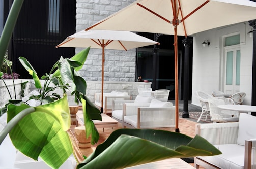 a patio with tables and chairs