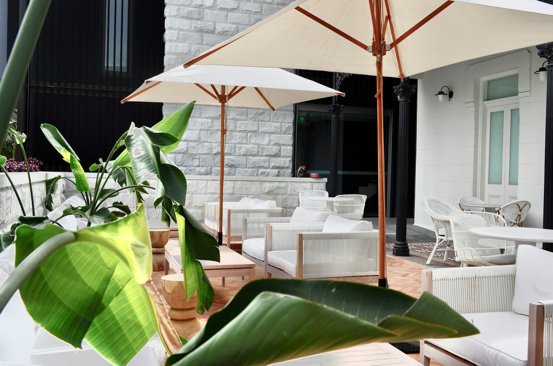 a patio with tables and chairs