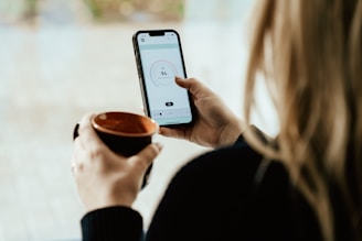 a person holding a cup of coffee